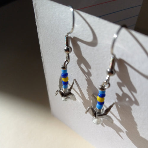 gray birds in a sunny sky